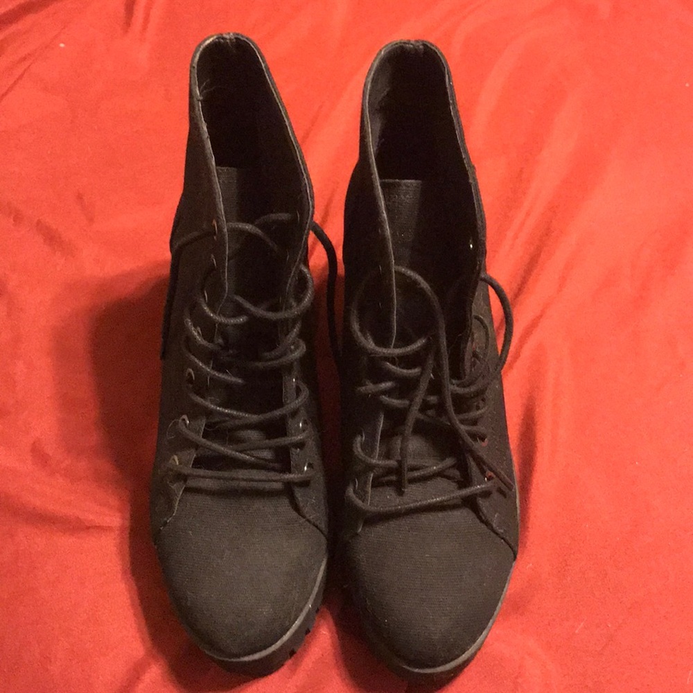 Heeled black lace up booties